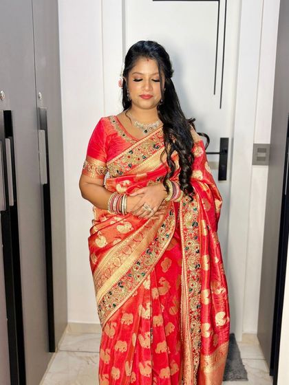 A serene portrait, her makeup looking soft and glowing.