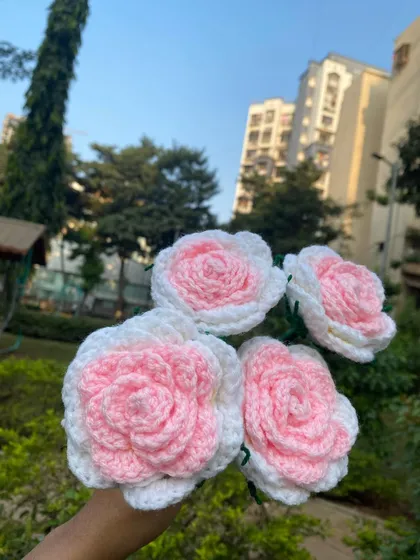 A close-up of these beautiful two-toned forever roses, with soft pink centers and white outer petals. They look so lovely against the natural green background.