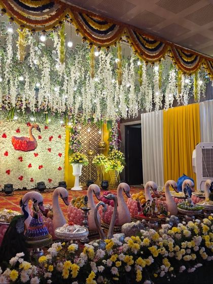 Another view of the swan-themed stage with its hanging white floral ceiling.
