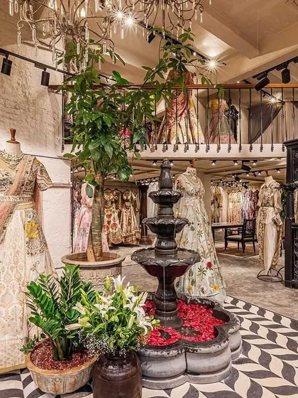 This wider view showcases the full scope of the spatial transformation, including the mezzanine level. Our design created a dynamic, multi-layered retail experience within the 1400 sq.ft. space, balancing open areas with more intimate corners for browsing.
