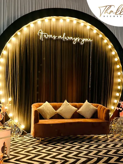 It's the details that make an event memorable. I designed this modern and chic photo booth with a custom neon sign, bulb lighting, and a geometric carpet to give the couple and their guests a stylish spot for pictures.