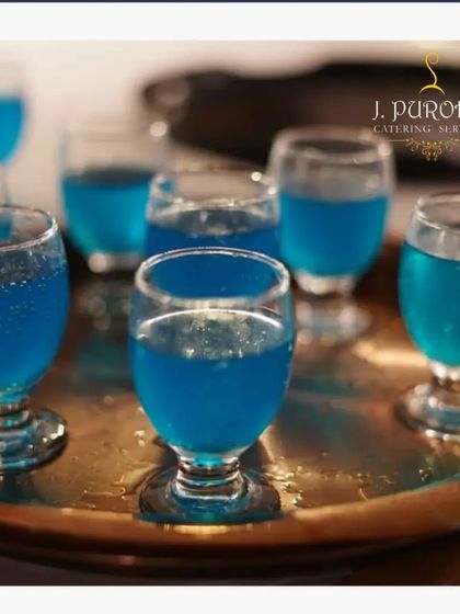 Welcome drinks set the tone for your event. I often serve these refreshing blue mocktail shots in elegant, small glasses as guests arrive. It's a simple touch that makes everyone feel immediately welcomed and ready to celebrate.