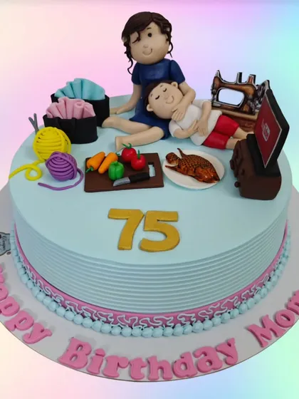 A heartfelt customized cake for a mom's 75th birthday. The toppers represent her life and loves, including her family, sewing, cooking, and watching TV.