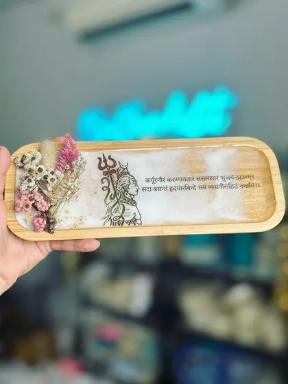 This tray is perfect as a decorative piece or for your personal pooja space. The combination of wood, resin, and flowers is so calming.