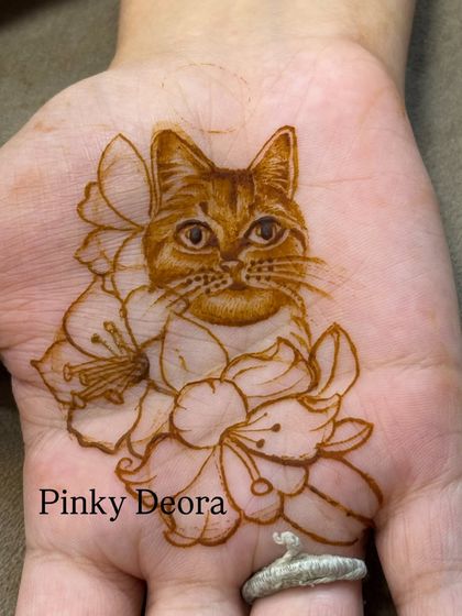 Are you team cat? This is a detailed portrait of a beautiful ginger cat, nestled among lily flowers. The fine lines capture the texture of its fur perfectly.