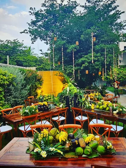 For this backyard dinner, I designed a zero-waste, farm-to-table concept. The decor is composed entirely of fresh fruits, vegetables, and foliage sourced directly from the host's farm, creating a rustic yet elegant setting that is both beautiful and sustainable.
