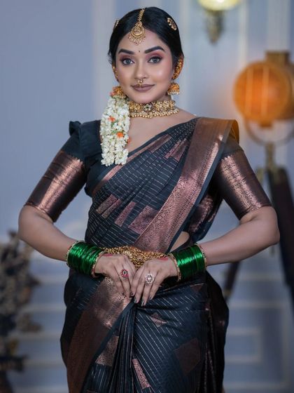 A classic South Indian look featuring a gold choker, green bangles, and a simple maang tikka. All pieces are available to rent individually or as a set.