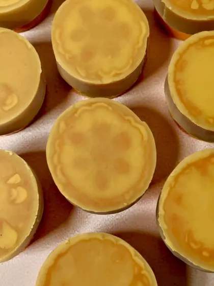Another view of the gentle ghost swirl pattern in these round facial soaps. The effect is subtle and beautiful, perfect for a nourishing face wash bar.