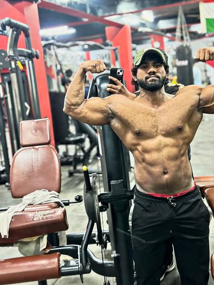 A front double bicep pose. This is a statement of power and dedication.