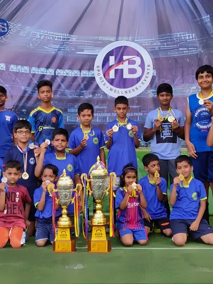 A team of champions with their medals and trophies against our branded backdrop. We create memorable victory moments for every winning team.