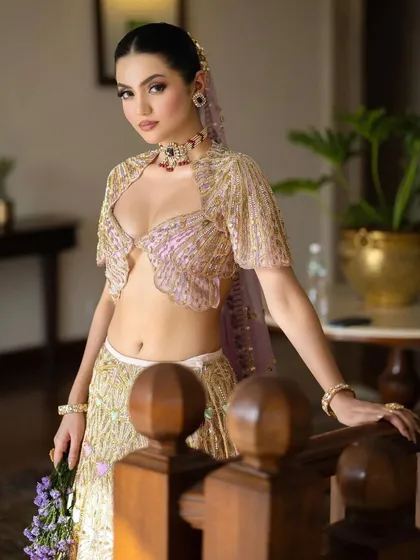 A full view of this unique Papa Don't Preach lehenga, showing the intricate embroidery and the beautiful blend of pastel colors.