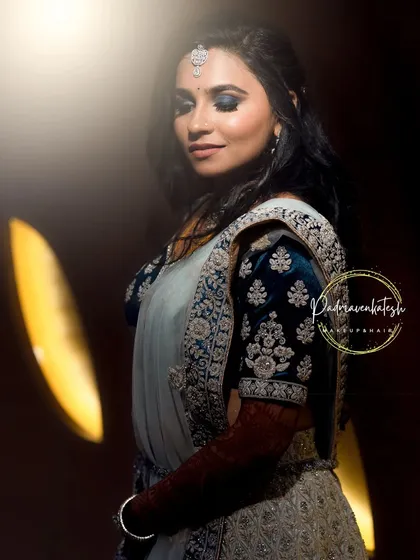 I love creating dramatic looks for receptions and evening events. Here, I designed a bold blue smokey eye paired with a soft lip color, a perfect combination for a glamorous look that photographs beautifully in low light.