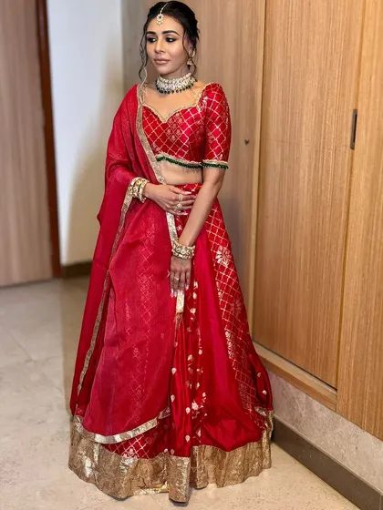 For her Mata Ki Chowki, this bride wore a stunning red outfit. I created a bold and beautiful look with traditional elements, including smoky eyes and a classic braided hairstyle, to honor the occasion.