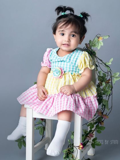This pastel gingham dress is perfect for a sweet and classic toddler portrait. I have a collection of props and outfits, but I also love when parents bring their own special items.
