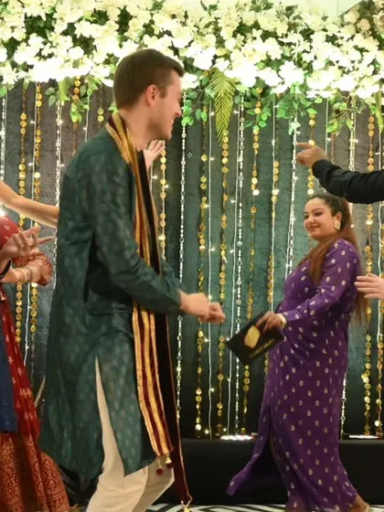I specialize in bringing people together, no matter where they come from. Here I am, leading a dance segment at a vibrant Maharashtrian-German wedding, ensuring that guests from different cultures connect, laugh, and share the dance floor in a celebration of unity and love.