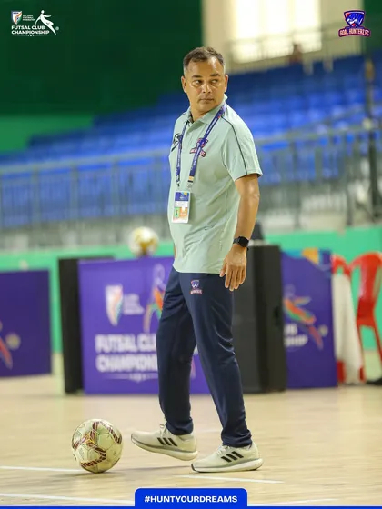 Our head coach observing the players during the quarter-final warm-up.