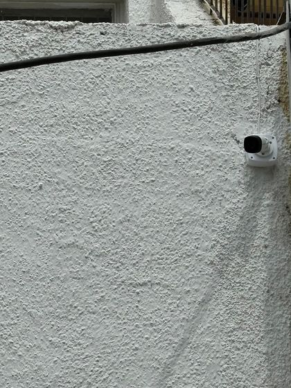 This camera is placed to monitor a blind spot along the side of a house. I identify and cover all potential vulnerabilities during my site survey.