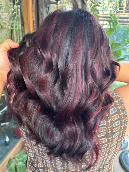 A close-up of the 'Fiddle Rose' color, showing the beautiful, deep red and purple tones.