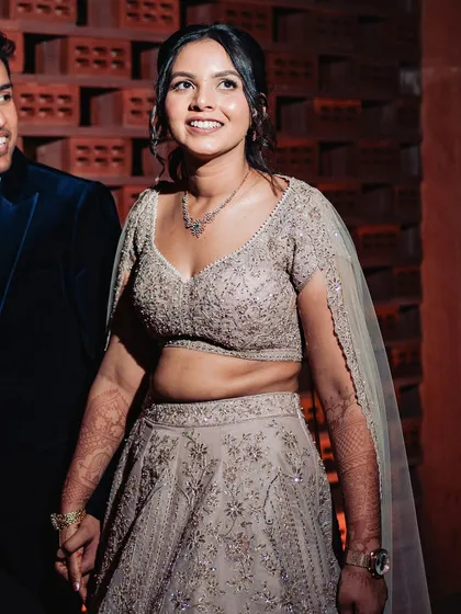 A beautiful portrait of Shilpi at her sangeet. The soft glam makeup enhances her features without overpowering her heavily embroidered lehenga.