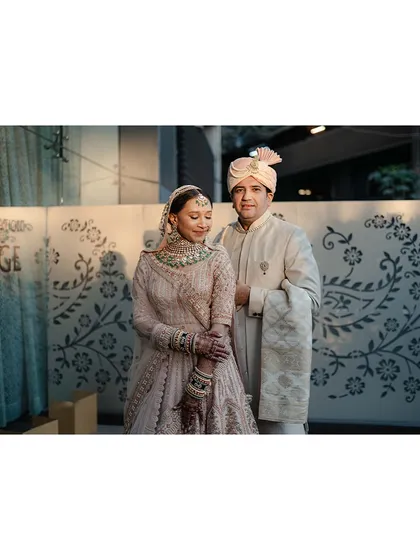 A classic, elegant portrait of the couple, using the venue's architecture as a simple and beautiful backdrop.