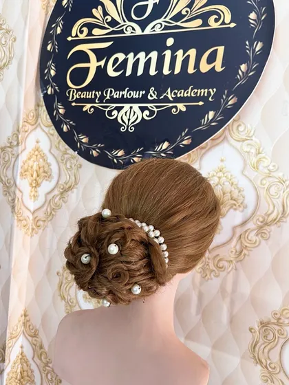 Another view of the textured bun, showing how the pearls are placed to enhance the design of the hairstyle.