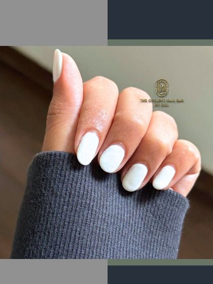 Clean, crisp, and timeless. A simple set of white nails is always a good idea.