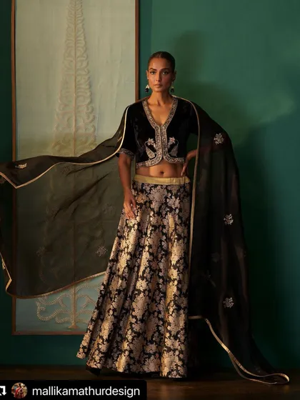 This look for a designer campaign pairs a gold zari brocade skirt with a hand-embroidered black velvet blouse. My styling, including the flowing organza dupatta, was intended to create a dramatic and luxurious black-and-gold ensemble.