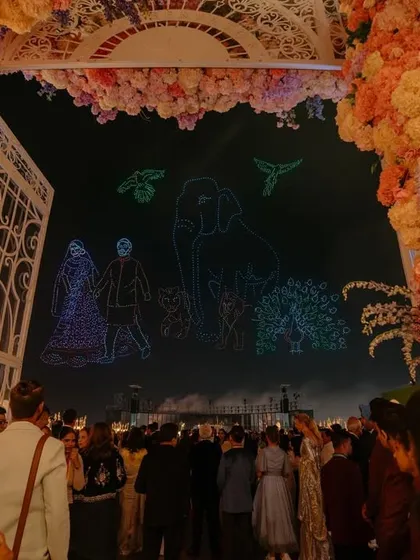 A spectacular drone light show from Radhika and Anant's pre-wedding celebration in Jamnagar, as seen in Vogue. This image captures the unique and personalized details that made their celebration so memorable.