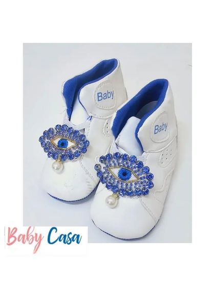 Protecting your little one in style. A mom wanted to safeguard her dude from evil eyes, so we created these custom baby shoes with a beautiful evil eye charm.