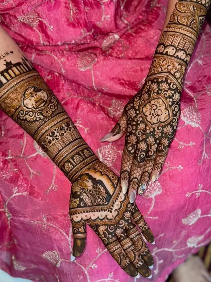 Another view of the personalized back-of-hand design, showing the heart-shaped motif with initials and the Berlin skyline on the arm.