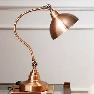 This antique-style table lamp brings a touch of retro charm to your desk. Crafted from iron with an imitation copper finish, its classic, adjustable design is perfect for focused task lighting in a bedroom or study.