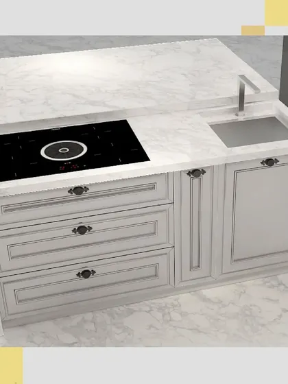 A detailed shot of the island, highlighting the induction cooktop and prep sink set within the durable, marble-look countertop.