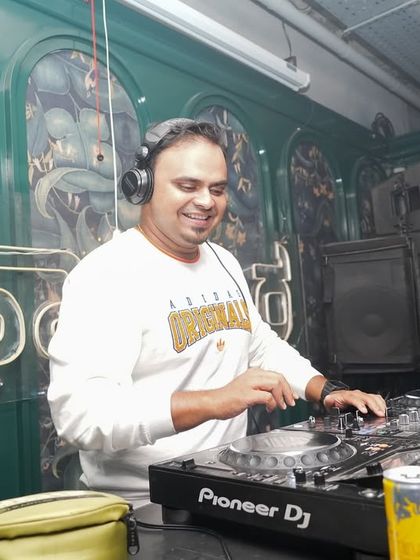 In my element, smiling as I mix. A happy DJ means a happy dancefloor.