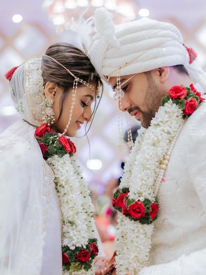 An intimate moment between the couple. The soft, natural makeup ensures the focus is on their connection.