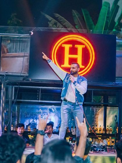 A full stage view of the Rock & Dhol night, showing me as the main act.