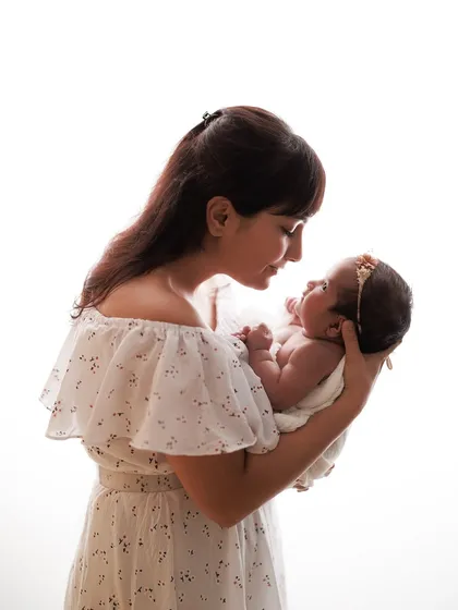The tender gaze between a mother and her baby is magical. I used backlighting here to create a warm, angelic glow around them.