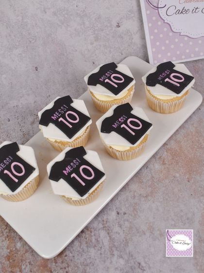 For a Messi fan, we created these custom cupcakes with his Inter Miami jersey. The toppers are made from fondant and carefully detailed.