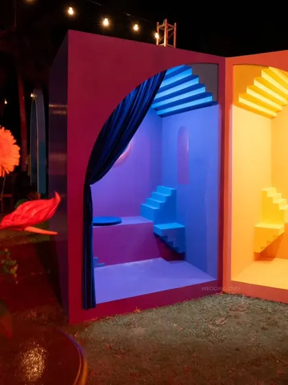 A look inside the "two worlds" photo booth. The contrasting colors, geometric steps, and soft curtain drapes created a unique, interactive, and highly photogenic installation.