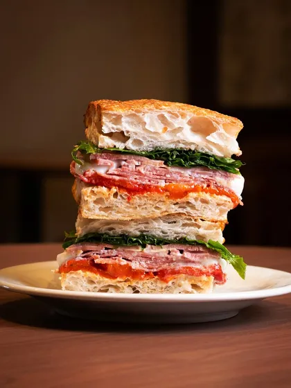 A great sandwich is a work of art. For this Italian Legend, I stacked it high to show off every single layer, from the fresh focaccia to the premium cold cuts, creating a hearty and heroic shot for the deli's menu.