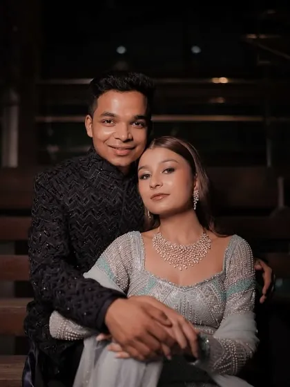 A beautiful couple portrait from their Sangeet night. Her makeup is soft and luminous, designed to look incredible in the low-light, romantic ambiance of the event.