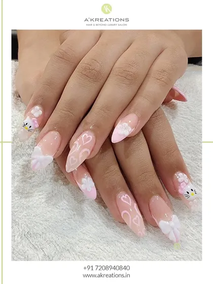 Bringing playful ideas to life is my favorite. This set features adorable, hand-painted Hello Kitty characters, 3D bows, and delicate heart patterns on long, elegant nail extensions for a fun and youthful style.
