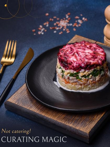 We aren't just catering, we are curating magic. This stacked salad with a vibrant beetroot topping is a perfect example of our approach to transforming classic dishes into modern culinary art.