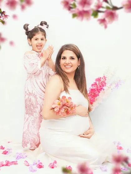 A joyful family maternity session celebrating the upcoming arrival with an older sibling. These moments are so special, capturing the excitement of the whole family in a fun, lighthearted setting.