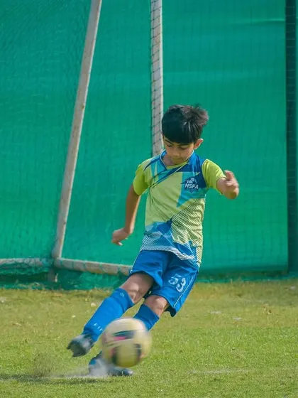 A player lines up a powerful shot, putting all his training into practice during a critical moment in the game.