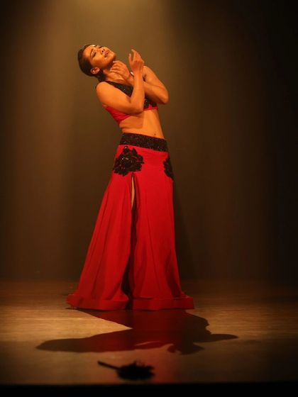 A solo performance still, showcasing the power of finding your light on stage.