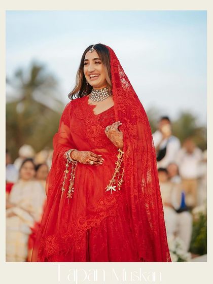 A joyful candid of the bride, Muskan. Her natural, happy expression is the best accessory. The makeup is designed to enhance this, not mask it, with a focus on glowing skin and bright eyes.