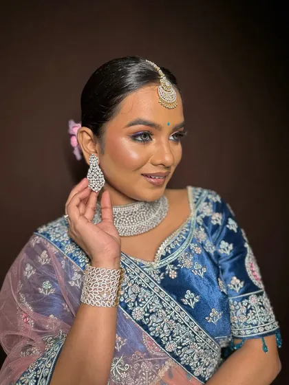 This shot highlights the stunning diamond earrings and how they complement the makeup.