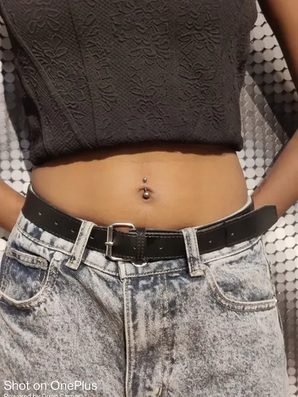Another example of a stylish navel piercing. Whether you prefer a simple stud or something more decorative, I can help you find the perfect piece of body jewelry for your new piercing.