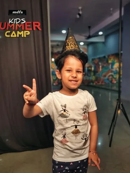 A young participant enjoying the fun at our summer camp. All your child needs to bring is a water bottle and a readiness to have a great time.