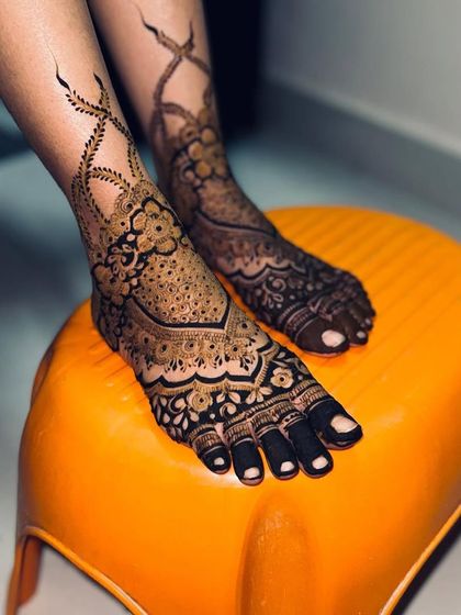 A top-down view of this beautiful bridal foot henna.